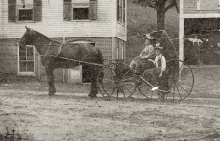 Horse, buggy and riders at the Dexter House.